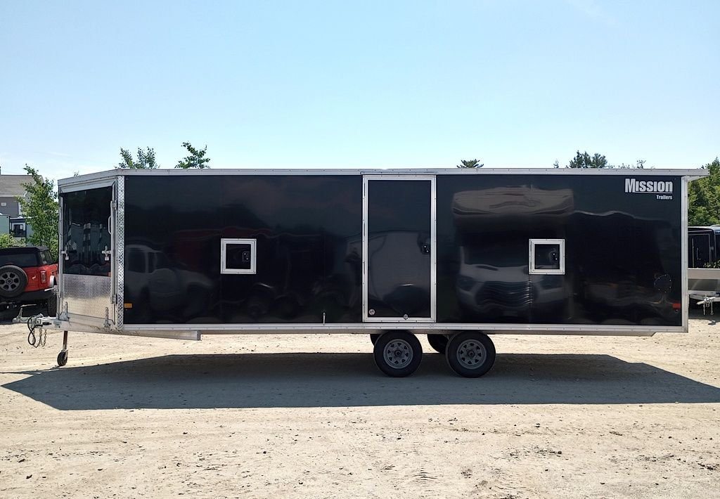 Mission Trailers 22 ft Snowmobile Trailer – 4-Place – Full side profile view of the long black enclosed tandem axle trailer