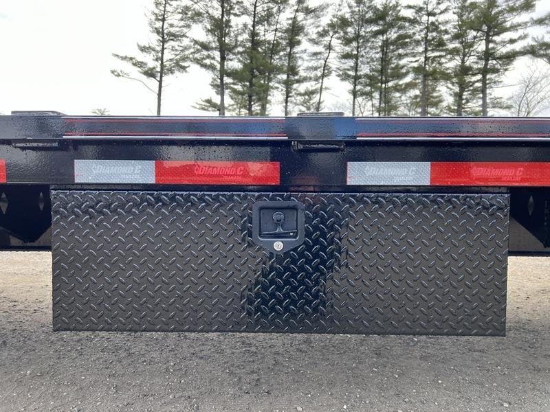 2024 Diamond C 35 ft Equipment Trailer – Auto Dovetail – Exterior view of a closed black metal tool box with latch