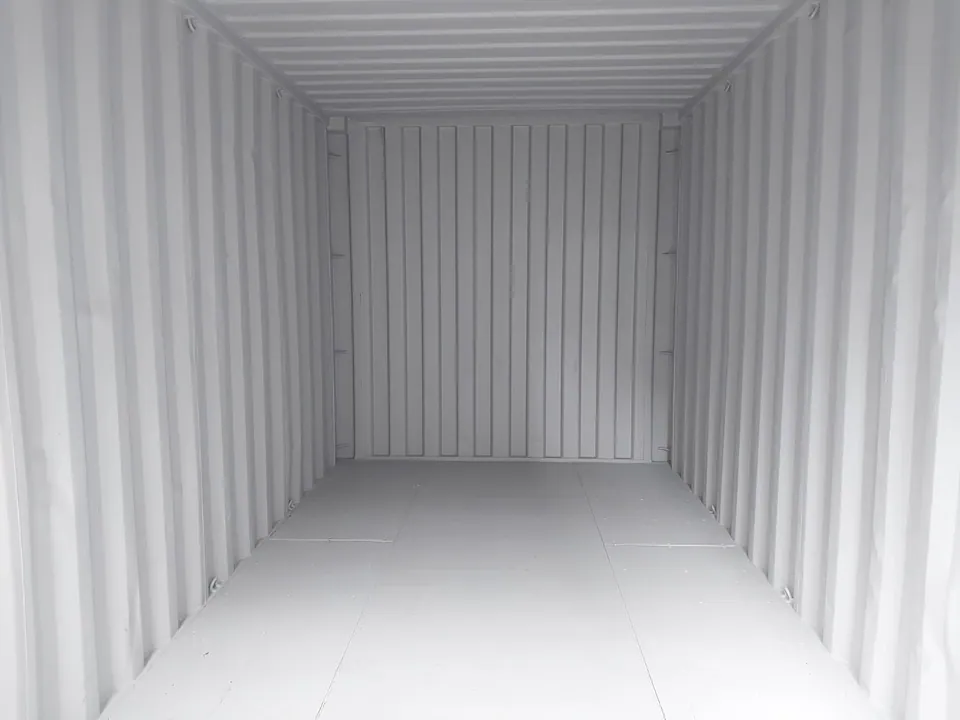 15ft Used Storage Container – Manual Roll-Up Door – empty container interior with light gray corrugated walls