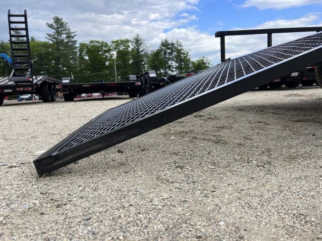 2024 Carry-On 12 ft Utility Trailer – Rear Ramp Gate – A low angle shot of the edge of the lowered mesh ramp gate