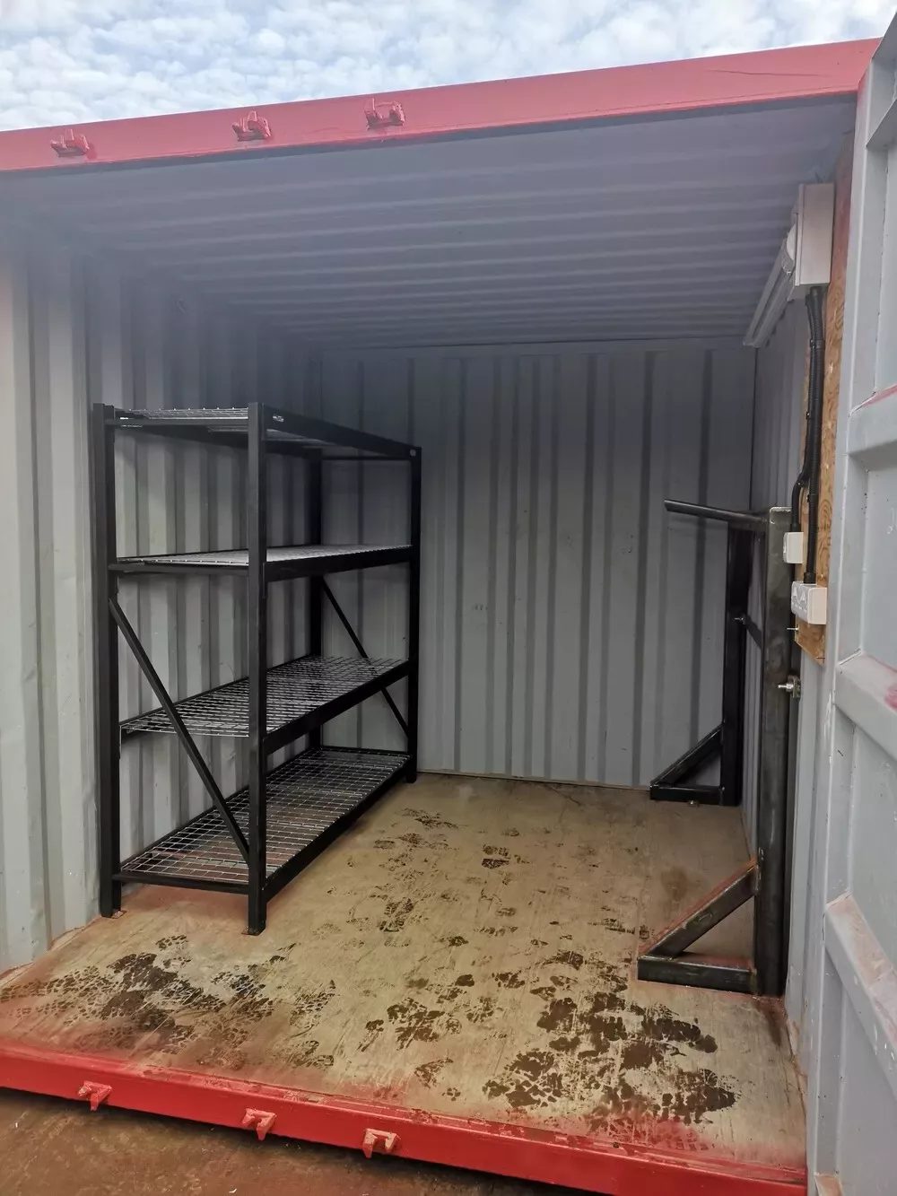 10ft Bespoke Steel Storage Container – Rigging Loft & Tackle Store – storage container interior with steel shelving and muddy plywood floor