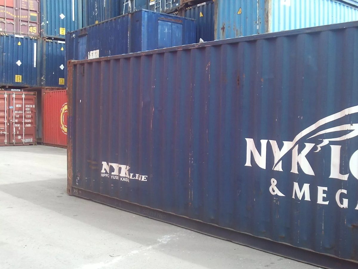 40ft Used Shipping Container – Standard Height, Double Doors – cropped side view of weathered container in stacked yard