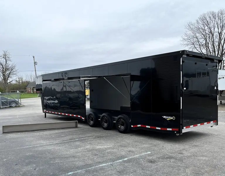 2025 ATC 44 ft Car Hauler – Premium Escape Door – Full side view of black trailer with premium escape door fully opened
