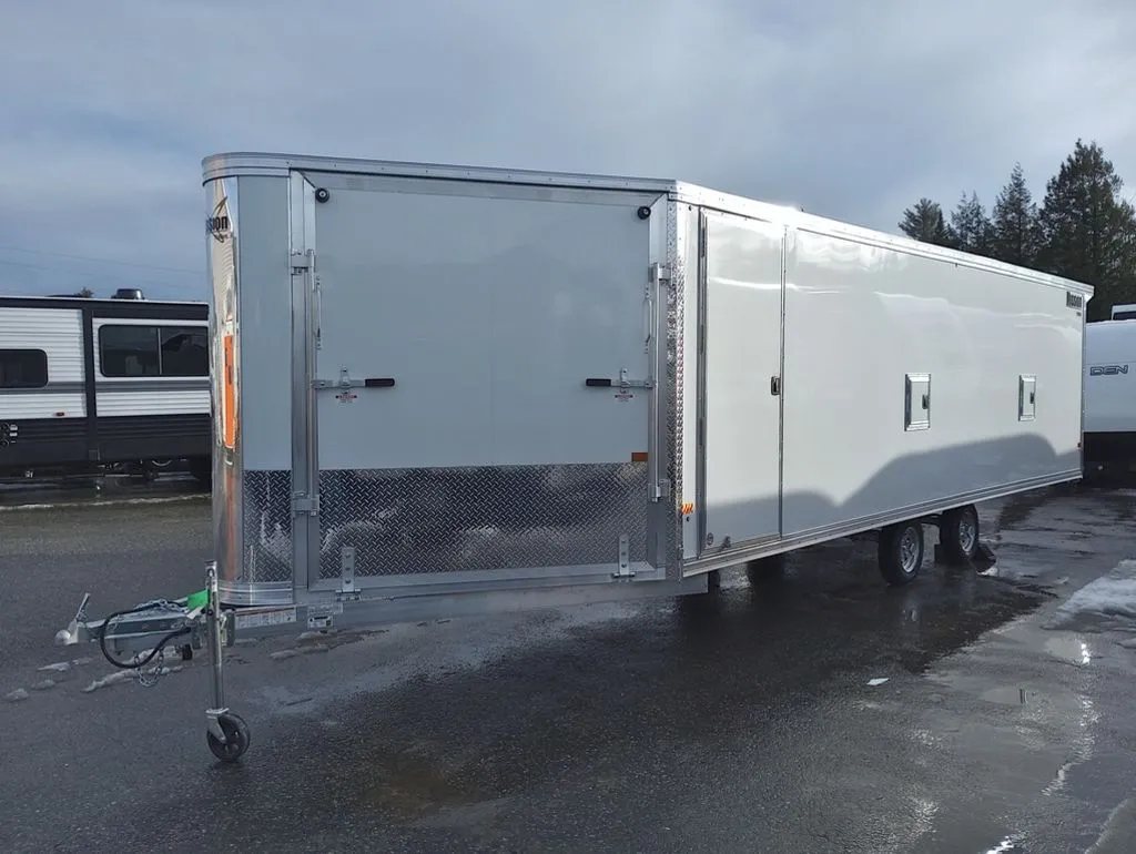 2024 Mission Trailers 24 ft Deckover – Galvanized Package – Full three-quarter view of the white enclosed trailer with front ramp door closed