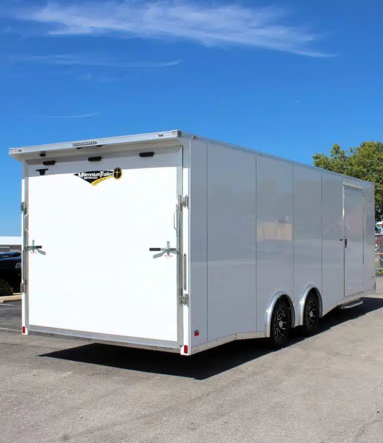 2026 Millennium 24 ft Car Hauler – White Blaze – Rear view of the enclosed trailer showing the ramp door closed