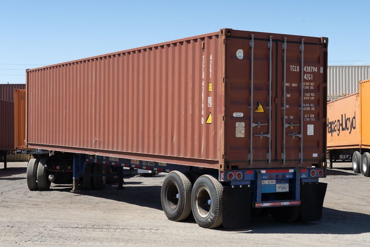40ft Used Cargo-Worthy Shipping Container – Standard Dry Storage – three-quarter exterior view of brown container on trailer, doors closed