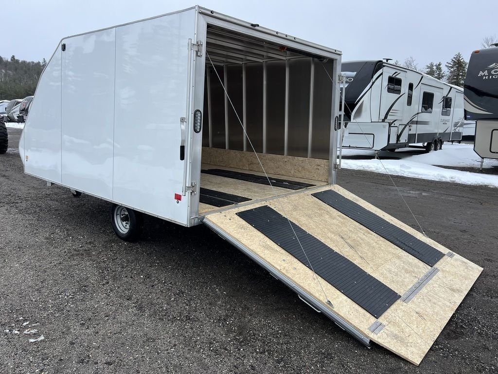 2022 High Country 12 ft Hybrid Trailer – Track Mats – Side angle of the open rear ramp door showing the wooden floor and tracks
