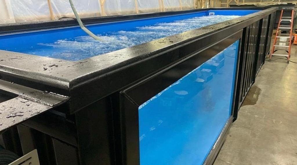 40ft Custom Container Pool – Side Viewing Window – black container pool with underwater viewing window in workshop