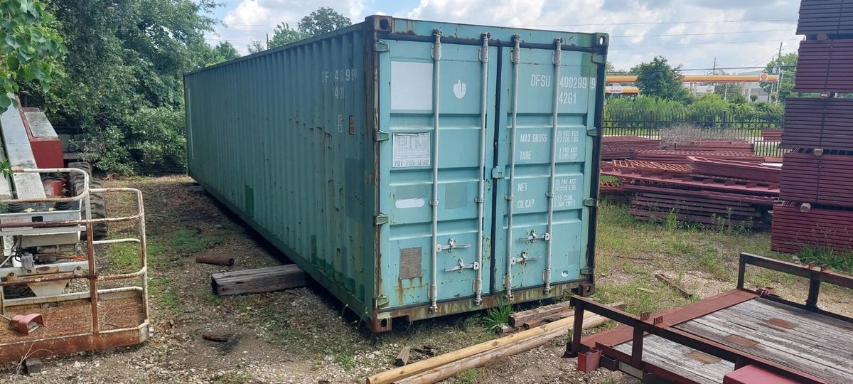 40ft Used Shipping Container – Wind & Watertight Storage – three-quarter exterior view of weathered container with closed cargo doors