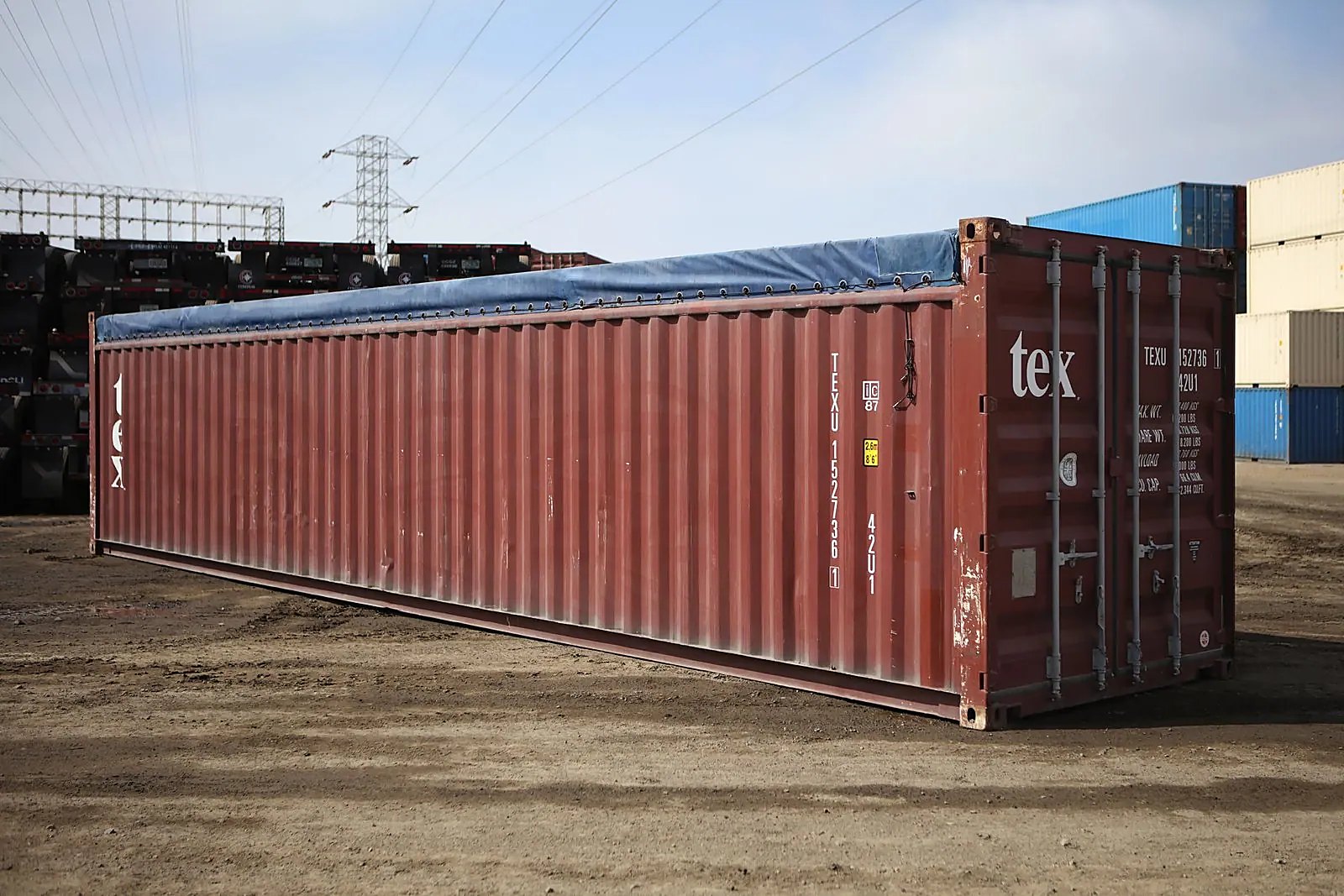 40ft Used Open Top Shipping Container – Oversized Cargo Access – three-quarter exterior of tarp-covered container with cargo doors closed