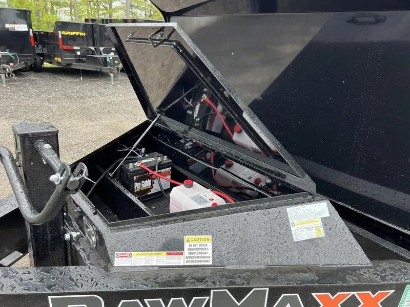 2024 RawMaxx 16 ft Dump Trailer – Tarp Kit – Close-up of the open tongue box showing batteries and hydraulic pump