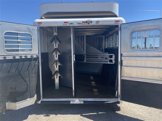 2000 Sooner 4 Horse Bumper Pull – Dressing Room, Awning – Rear view with double doors fully open showing the interior stalls