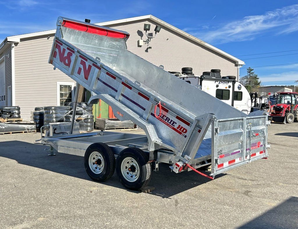 2024 N&N Trailers 14 ft Dump – Galvanized Steel – Three-quarter rear view of a galvanized dump trailer with the bed raised