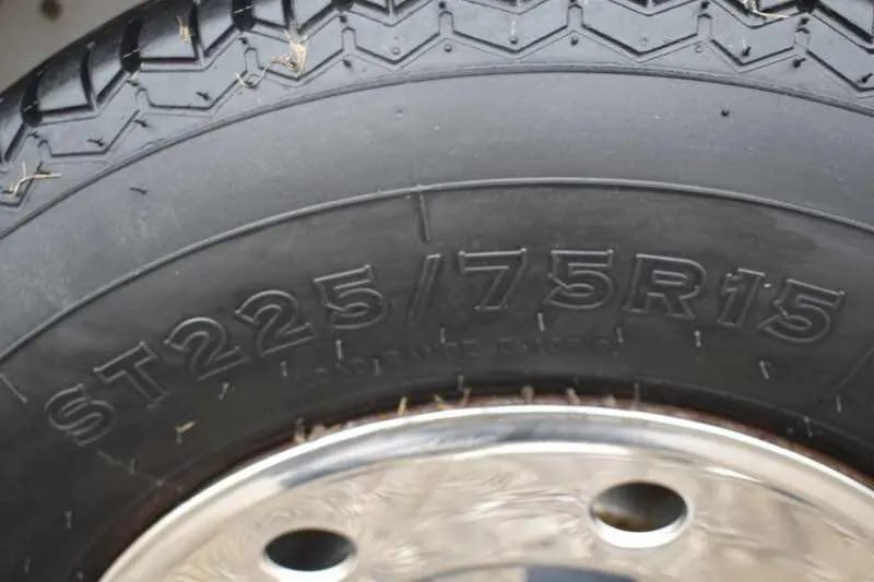 1995 Featherlite 2 Horse Trailer – Aluminum, Dressing Room – Close-up of the tire sidewall markings indicating size specifications