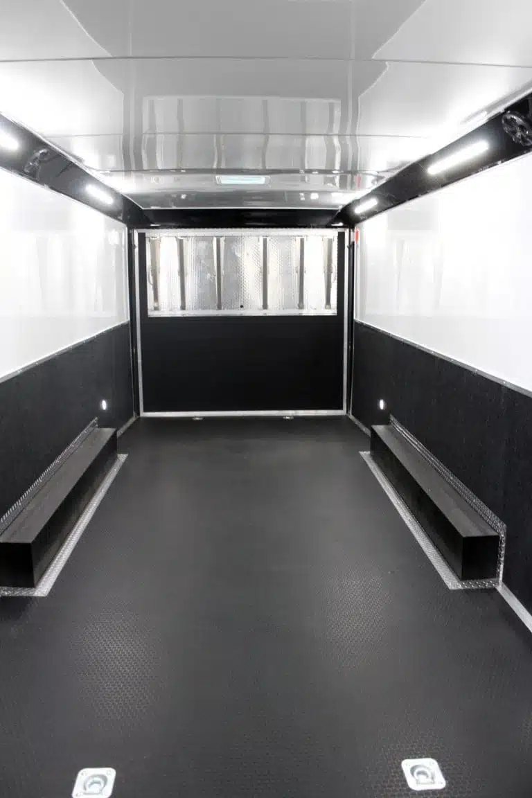 2025 Haulmark Edge 28 ft Enclosed Car Trailer – White – Clean black and white interior of an enclosed trailer with strip lighting