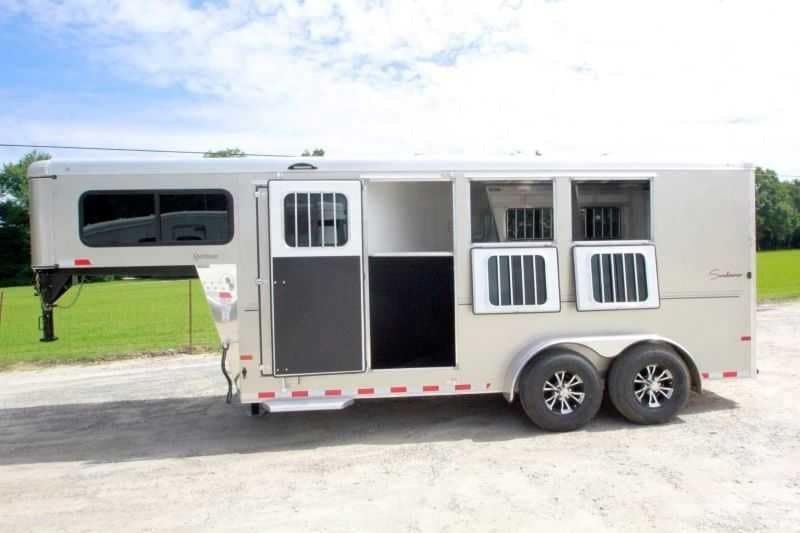 2016 Sundowner 3 Horse Gooseneck – Aluminum, Dressing Room – Side profile of the trailer with the tack room door and horse dividers open