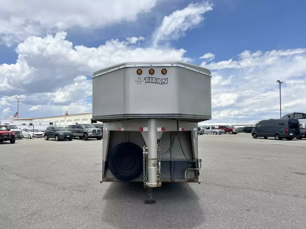 2001 Titan 3 Horse Gooseneck Trailer – Steel, Dressing Room – Straight front view of the gooseneck trailer showing the hitch and spare tire