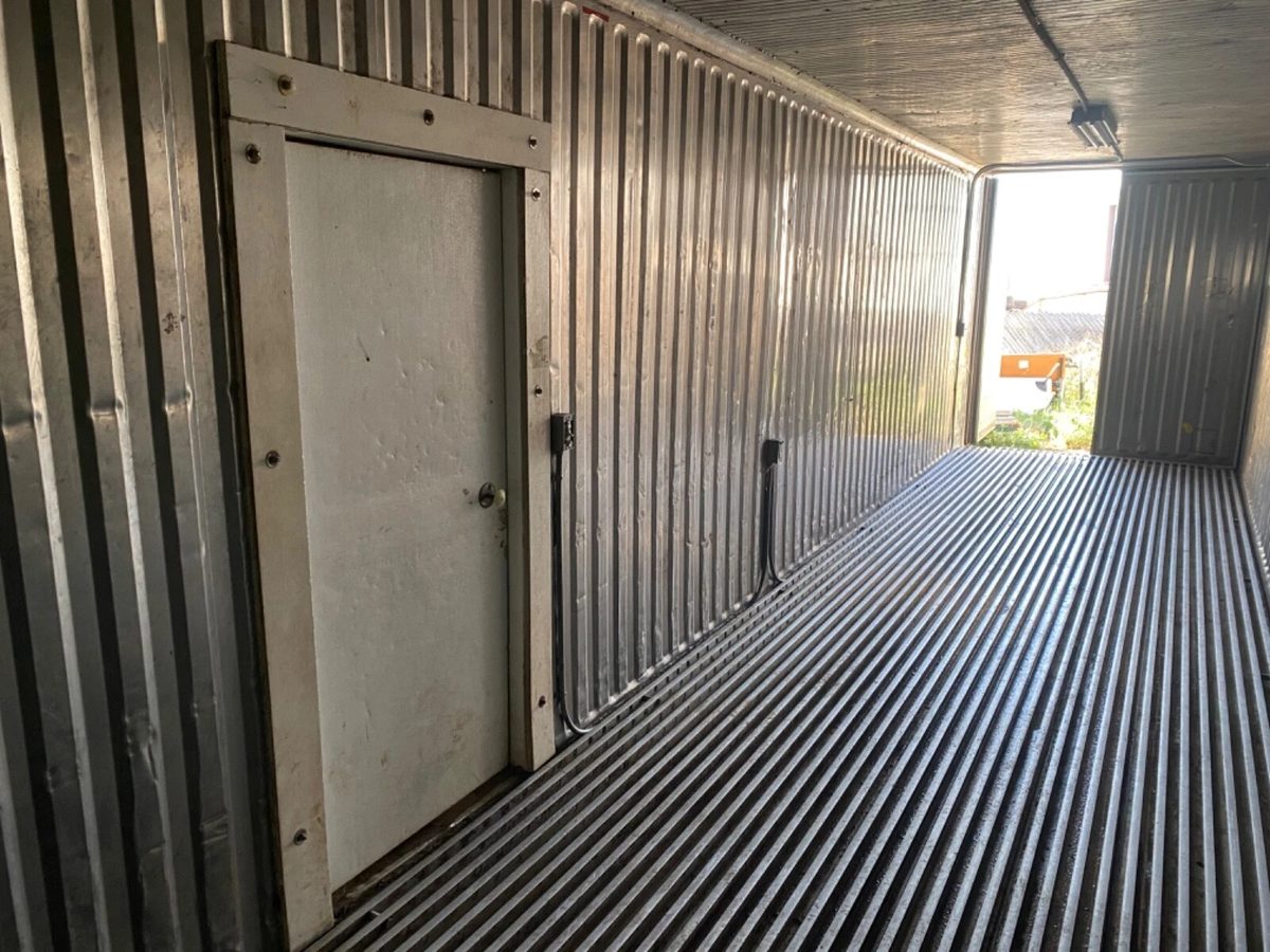 40ft Used Refrigerated Shipping Container – Custom Side Door – empty refrigerated container interior with side door and ribbed flooring