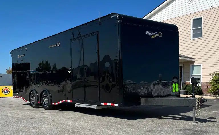 2025 Haulmark Edge 28 ft Car Trailer – Blackout, Turbo – Exterior view of black enclosed trailer showing street side and side entry doors