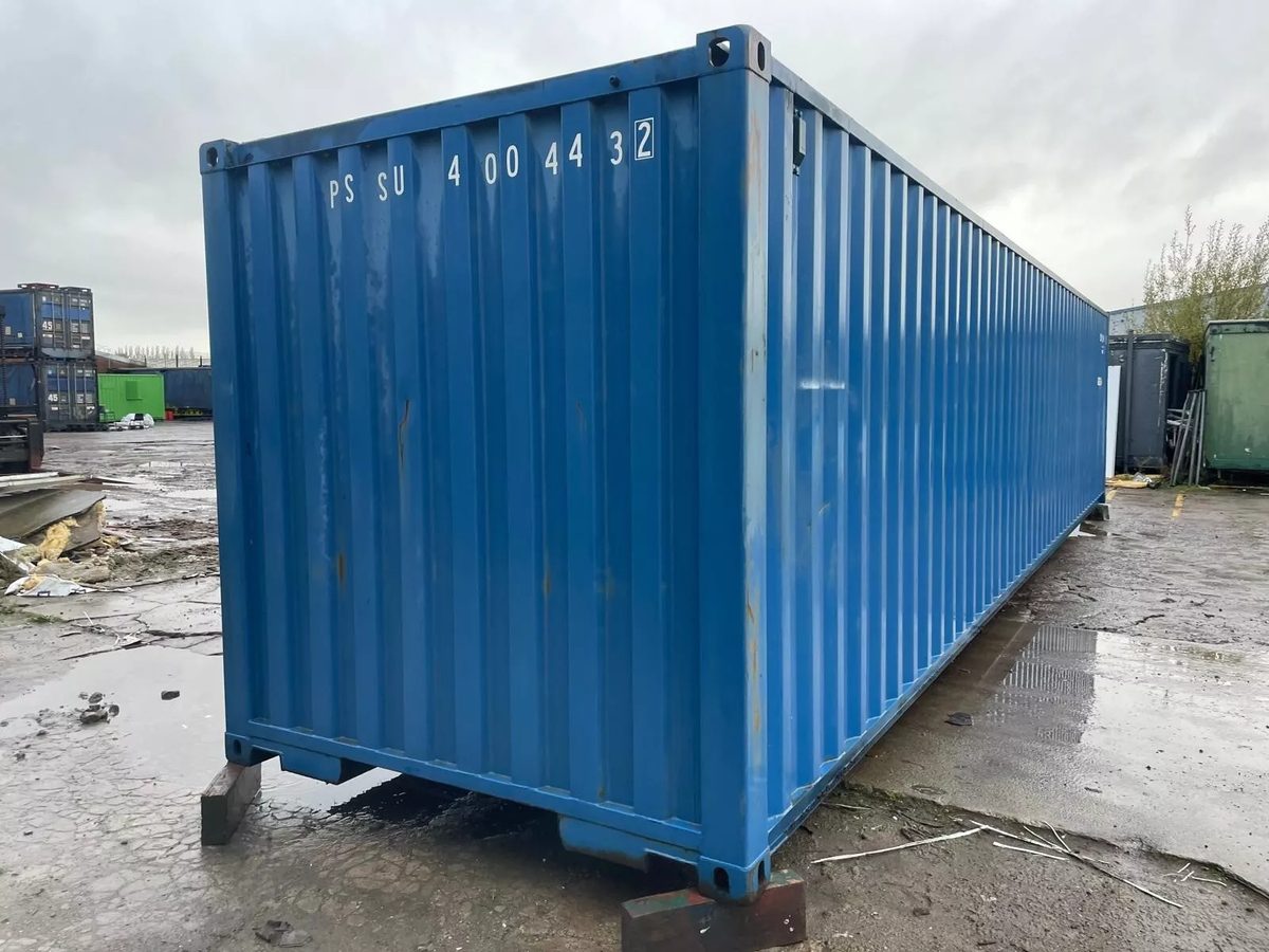 40ft Used Shipping Container – Roll-Up Door, Power & Lighting – three-quarter exterior view of blue container with solid end wall