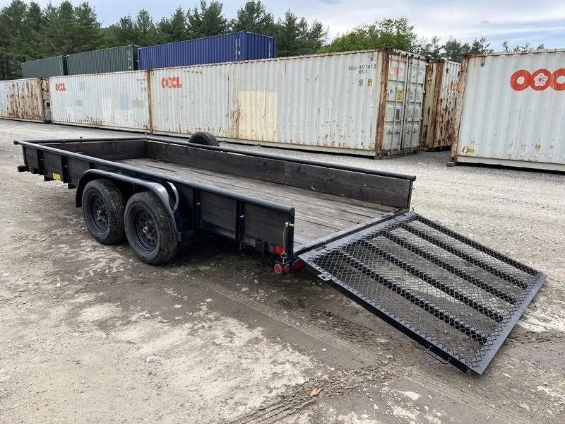 2021 Big Tex 16 ft Utility Trailer – Ramp Gate & Spare – Rear three-quarter view showing the mesh ramp gate lowered to the ground