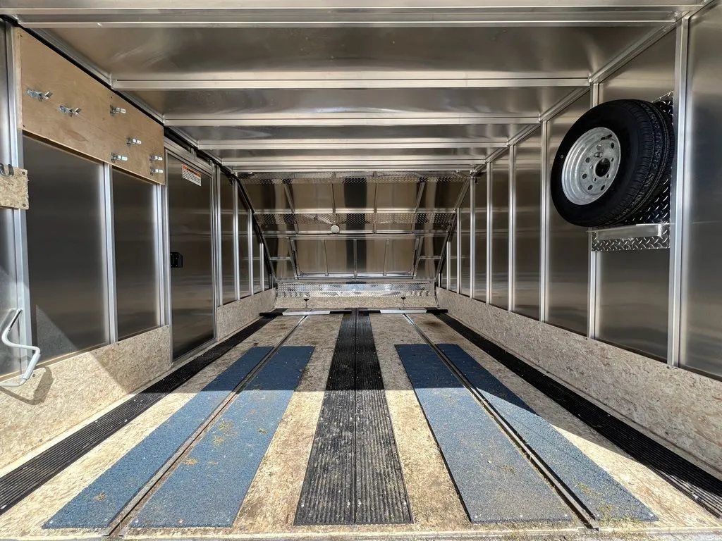 2023 Sno Pro 2-Place Snowmobile Trailer – Galvanized Package – Full length interior view showing wood flooring with black and blue ski guides