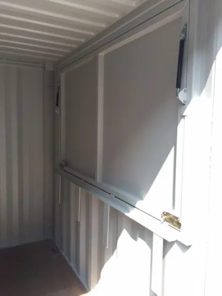 10ft Custom Bar Container – Serving Hatch and Secure Storage – empty container interior with closed serving hatch and support struts