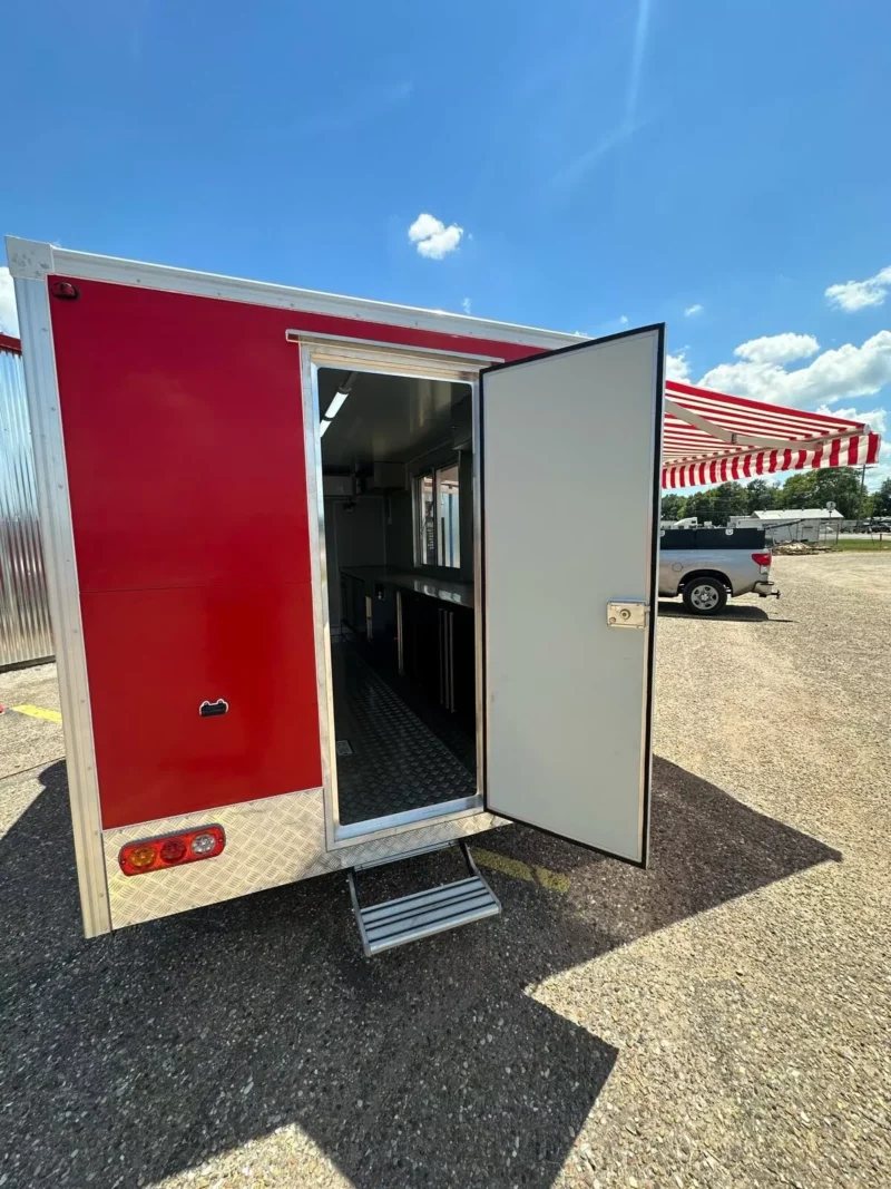 14 ft Food Trailer – Red Finish – Exterior rear view of the red trailer with the door wide open