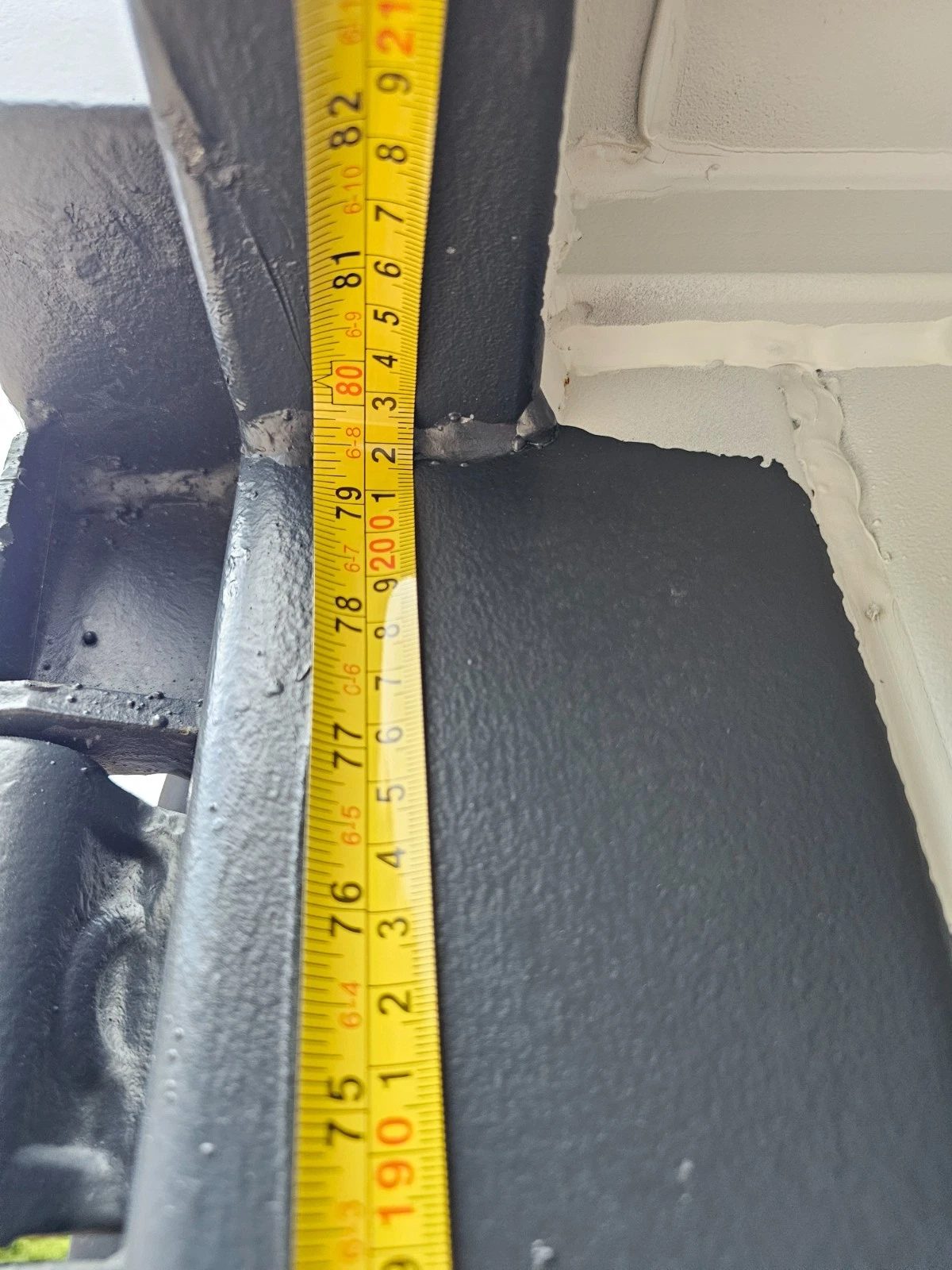 8ft New Shipping Container – Lockbox and Barred Windows – measuring tape alongside container door frame and ceiling joint