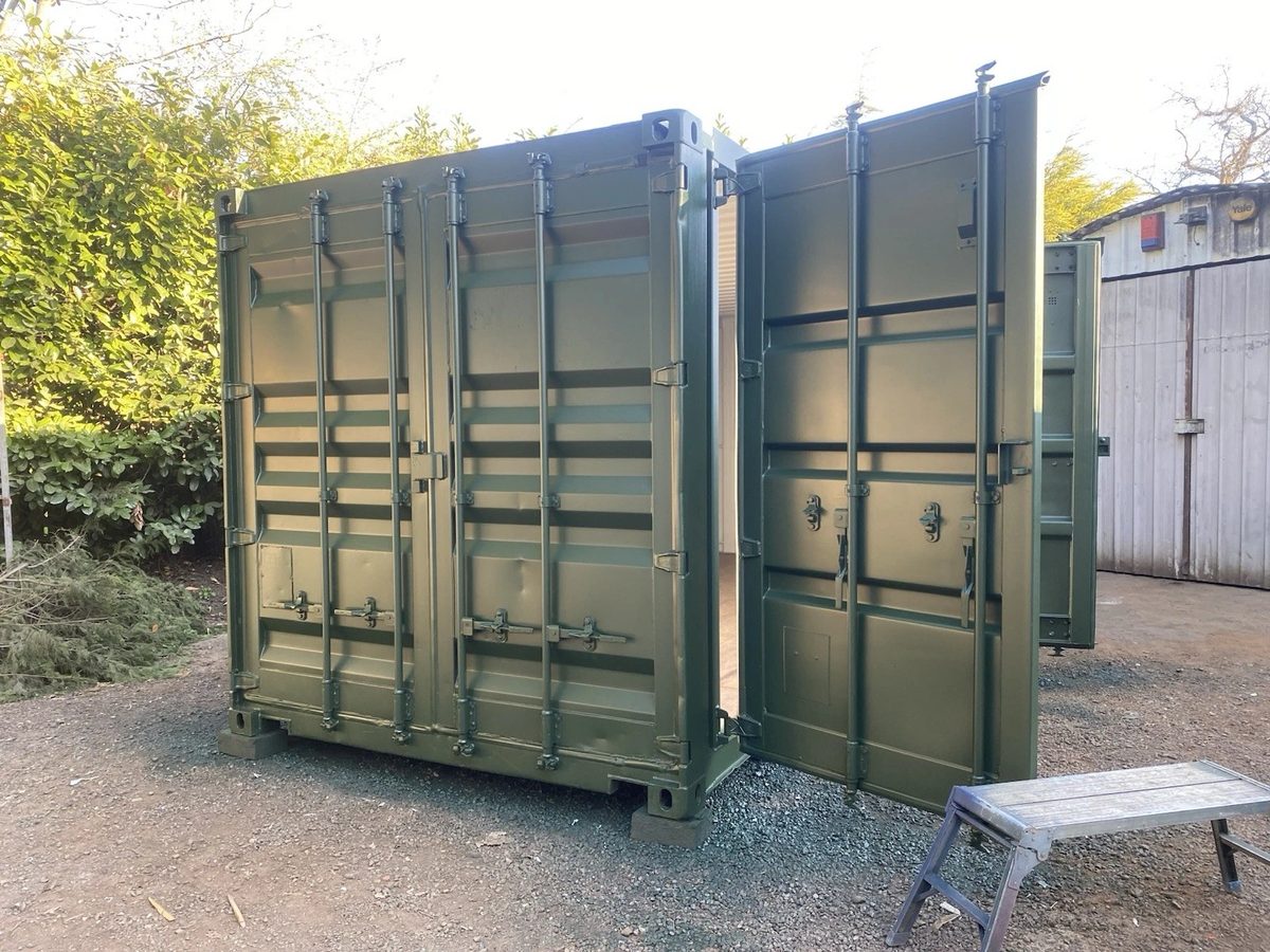 20ft Refurbished Shipping Container – Full-Length Side Access – green storage container with partially open cargo doors