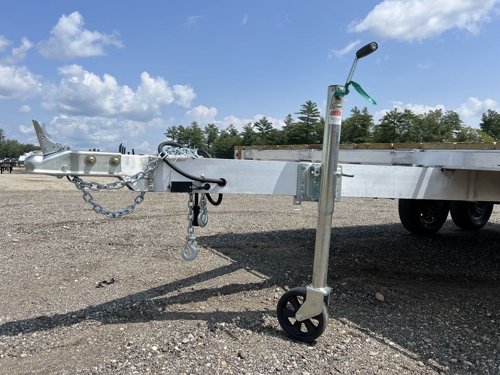 2024 Cargo Pro 101 in Deckover Trailer – Aluminum – Close-up view of the trailer tongue, coupler, safety chains, and swivel jack