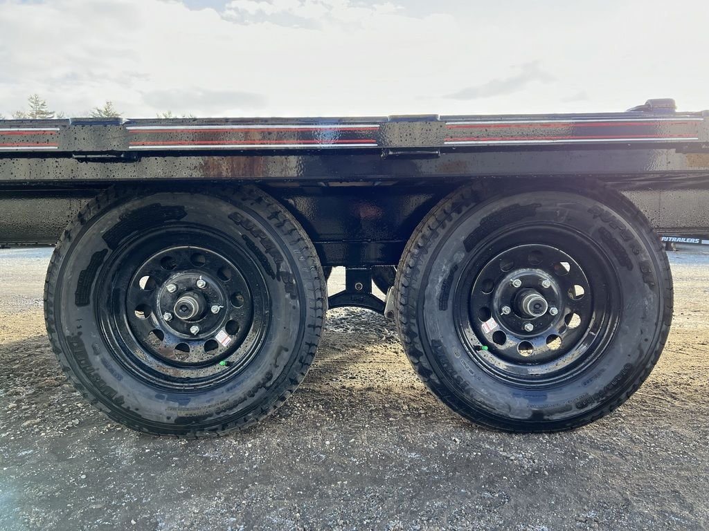 2024 Diamond C 22 ft Deckover Trailer – Slide-In Ramps – Close-up view of the dual axles and black wheels under the trailer