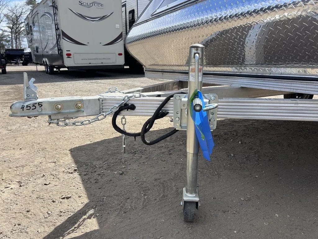 2023 Sno Pro 2-Place Snowmobile Trailer – Galvanized Package – Close up view of the trailer tongue, coupler, and swivel jack stand