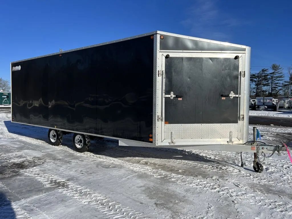 2008 Sno Pro 4-Place Snowmobile Trailer – Black Aluminum – Front perspective showing the closed front ramp door and hitch