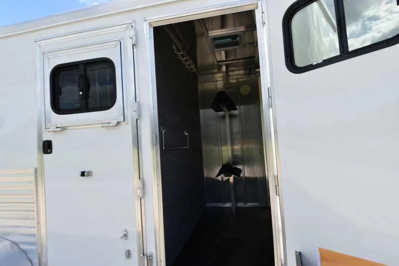 2018 Lakota 2HBPST 2 Horse Trailer – Dressing Room – Looking into the front dressing room showing saddle racks and bridle hooks