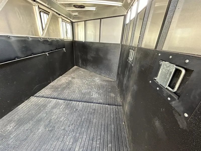 2022 Logan Coach Crossfire 3 Horse Trailer – Swing-Out Saddle Rack – Horse area interior showing rubber floor mats and padded wall dividers