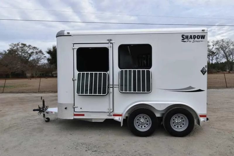 2016 Shadow 2HBP 2 Horse Bumper Pull Trailer – Aluminum – Side profile of horse trailer with window screens and tandem axles