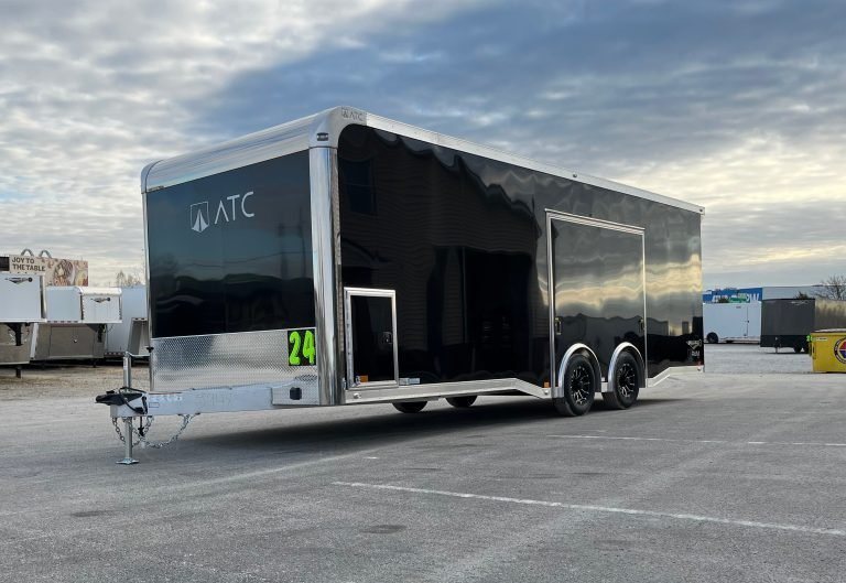 2026 ATC 24 ft Car Hauler – Black, Plus Package – Front three-quarter view of the black aluminum trailer showing the hitch and side profile