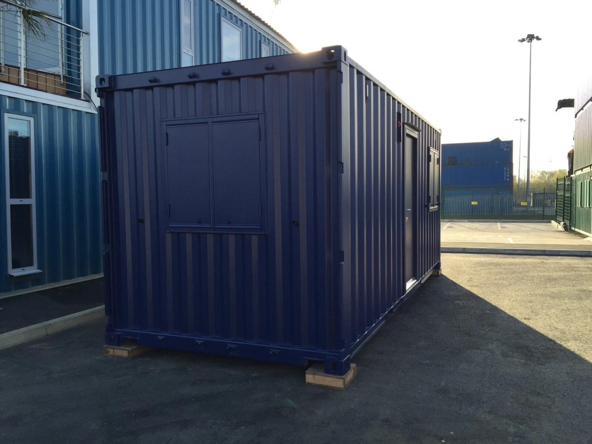 20ft Portable Office Cabin – Insulated Steel Workspace – Three-quarter exterior of portable office with shuttered windows and side door