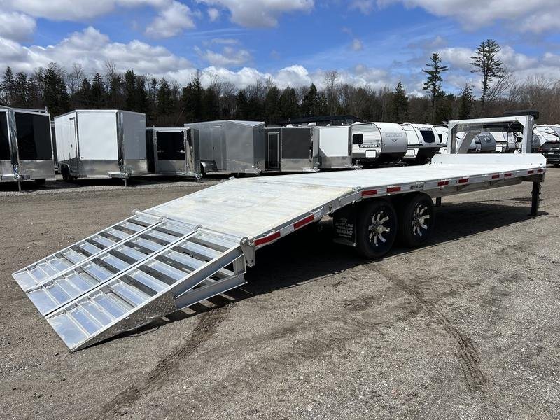 2024 Alum-Line 24 ft Gooseneck – Flip-Over Ramps – Rear three-quarter view of the aluminum trailer showing the deck and lowered ramps