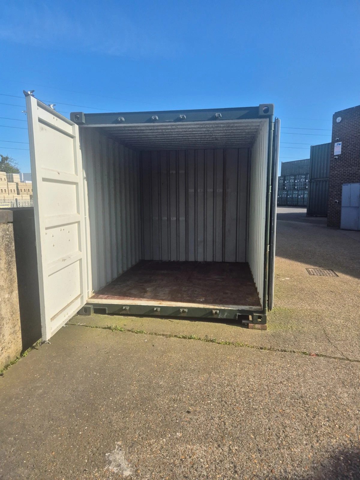 40ft One-Trip Shipping Container – Five Side Doors – open container doorway showing empty interior and wooden floor