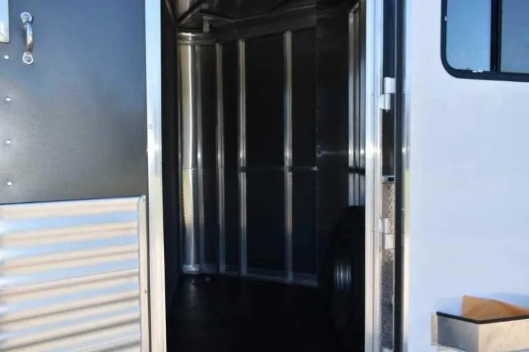 2018 Lakota 83HBPSL 3 Horse Trailer – Aluminum – Looking through the entry door into the empty front tack area