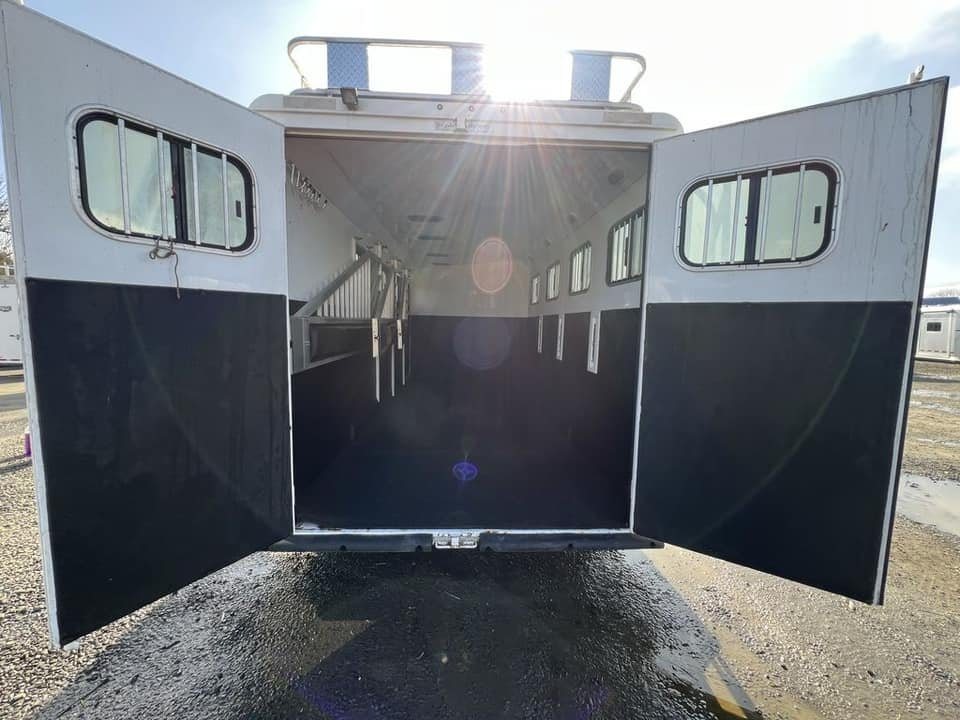 2020 Trails West Sierra 4 Horse Gooseneck – Comfort Package – Rear double doors fully open showing the interior stall space