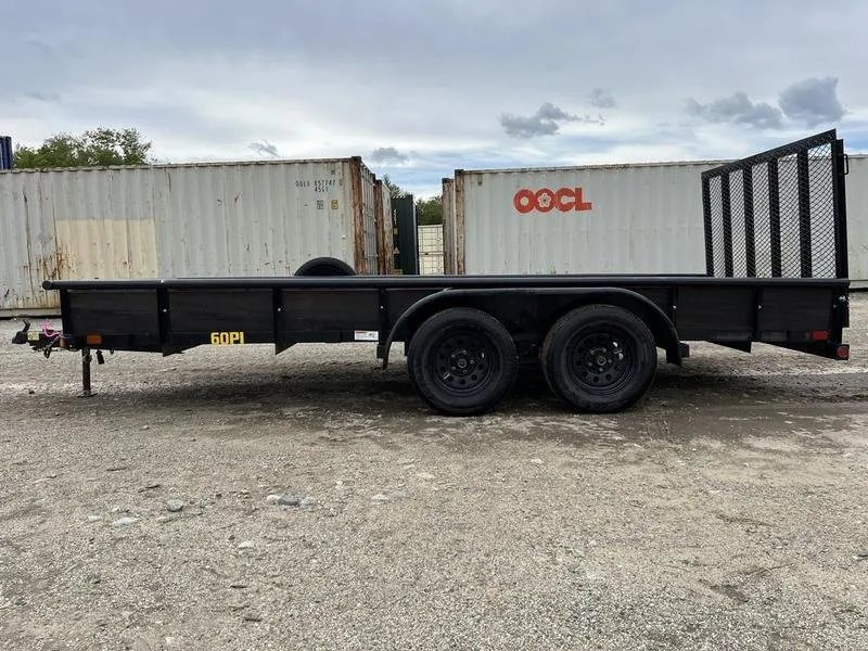 2021 Big Tex 16 ft Utility Trailer – Ramp Gate & Spare – Clean side profile of the trailer parked on a gravel lot