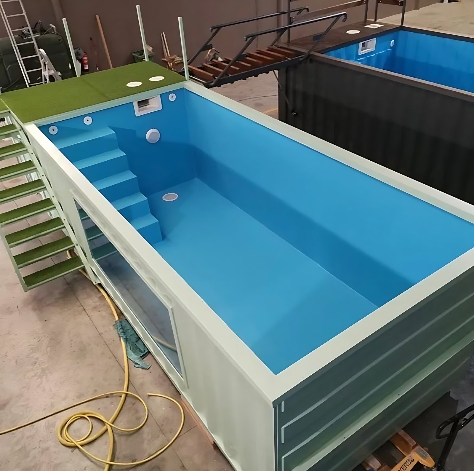30ft Custom Container Pool – Configurable Finishes – elevated view of empty container pool with blue lining