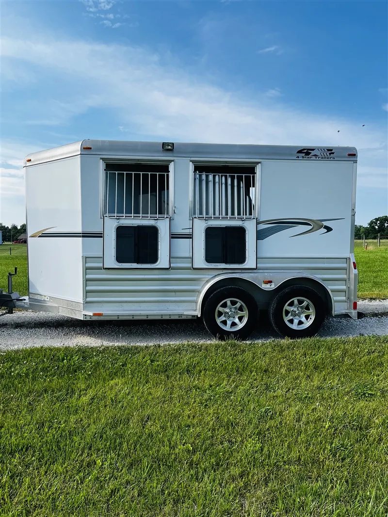 2015 4 Star 2 Horse Bumper Pull – Slant Load, Rear Tack – Full side view of the trailer with drop windows in the down position