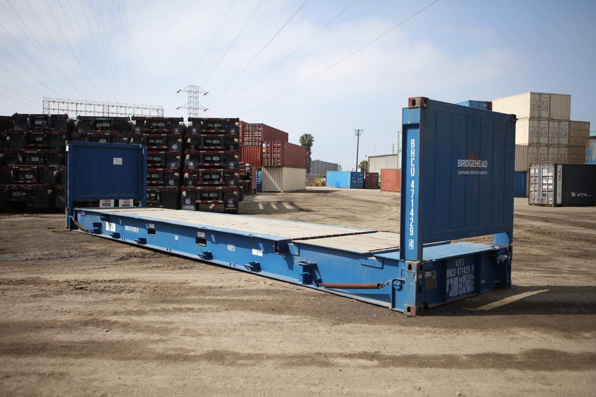 40ft Used Flat Rack Container – Open-Side Loading – blue flat rack container with upright ends in storage yard