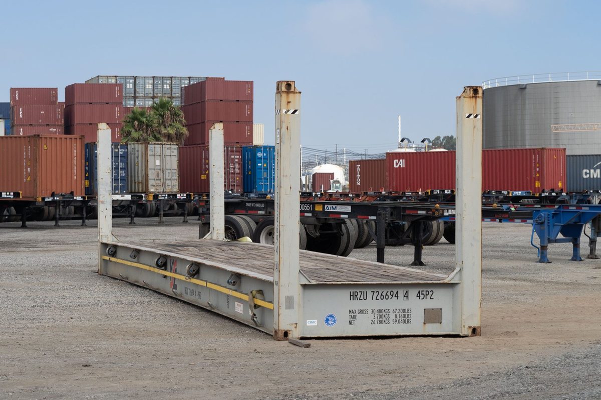 20ft Cargo-Worthy Flat Rack Container – Open-Sided Loading – three-quarter exterior view of flat rack with upright corner posts