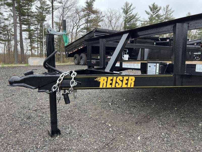 2024 Reiser Trailers 12 ft Landscape Trailer – Ramp Gate – Close-up of the trailer tongue, coupler, and safety chains with the manufacturer name