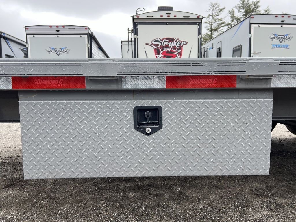 2024 Diamond C Deckover Equipment Trailer – Cement Gray – Close-up of a diamond plate metal storage box mounted under the trailer bed